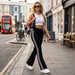 Pantalones acampanados de cintura alta con rayas laterales