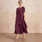 Elegante vestido en capas con mangas con volantes