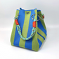 Bolso de mano de balde de punto a rayas