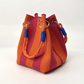 Bolso de mano de balde de punto a rayas